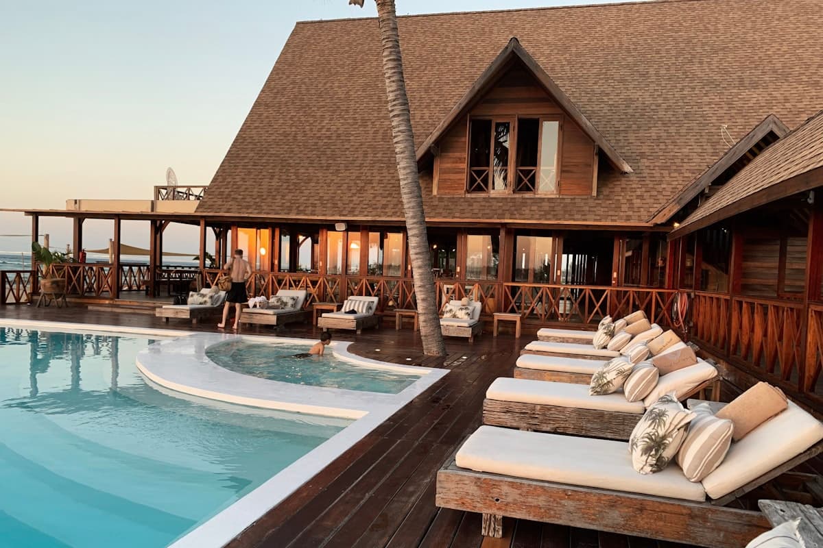 Luxury resort poolside lounge at sunset